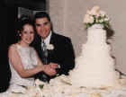 Wedding - Lori and Matt - Cutting cake.JPG (22860 bytes)
